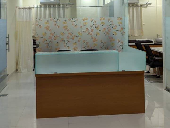 Reception counter where appointments are checked in at the rheumatology clinic in Ravet