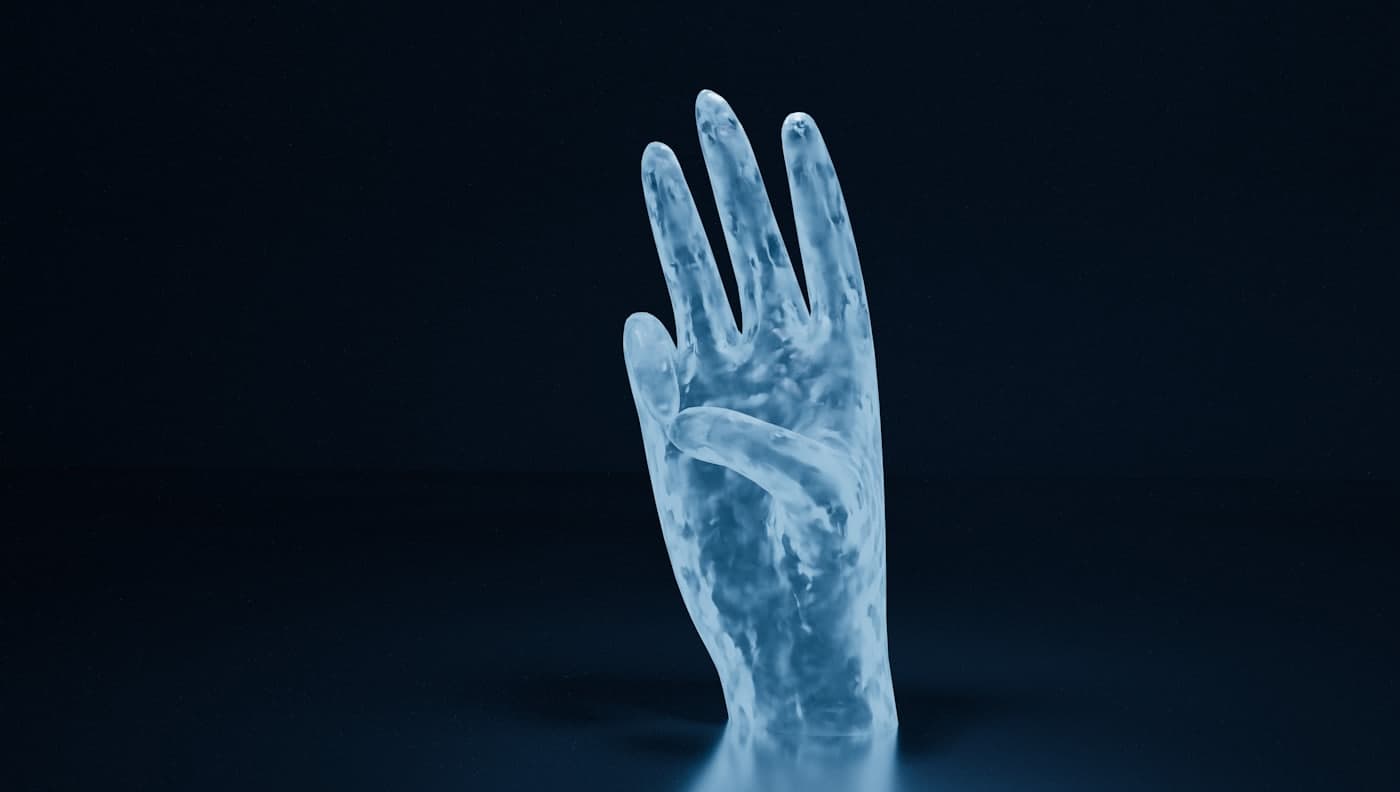 A translucent X-ray style image of a hand against a dark background