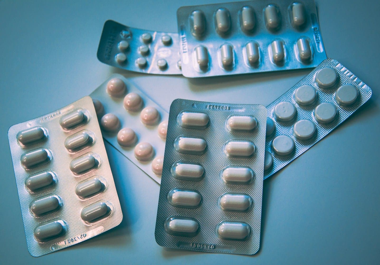 Several blister packs of tablets and capsules